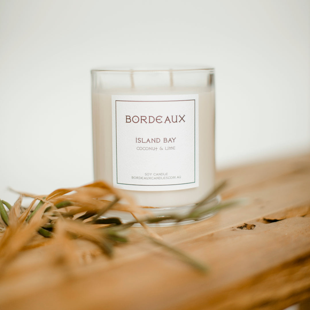 coconut and lime island bay candle in a classic glass vessel with knob lid and two wicks | Bordeaux Candles | Bordeaux Collective